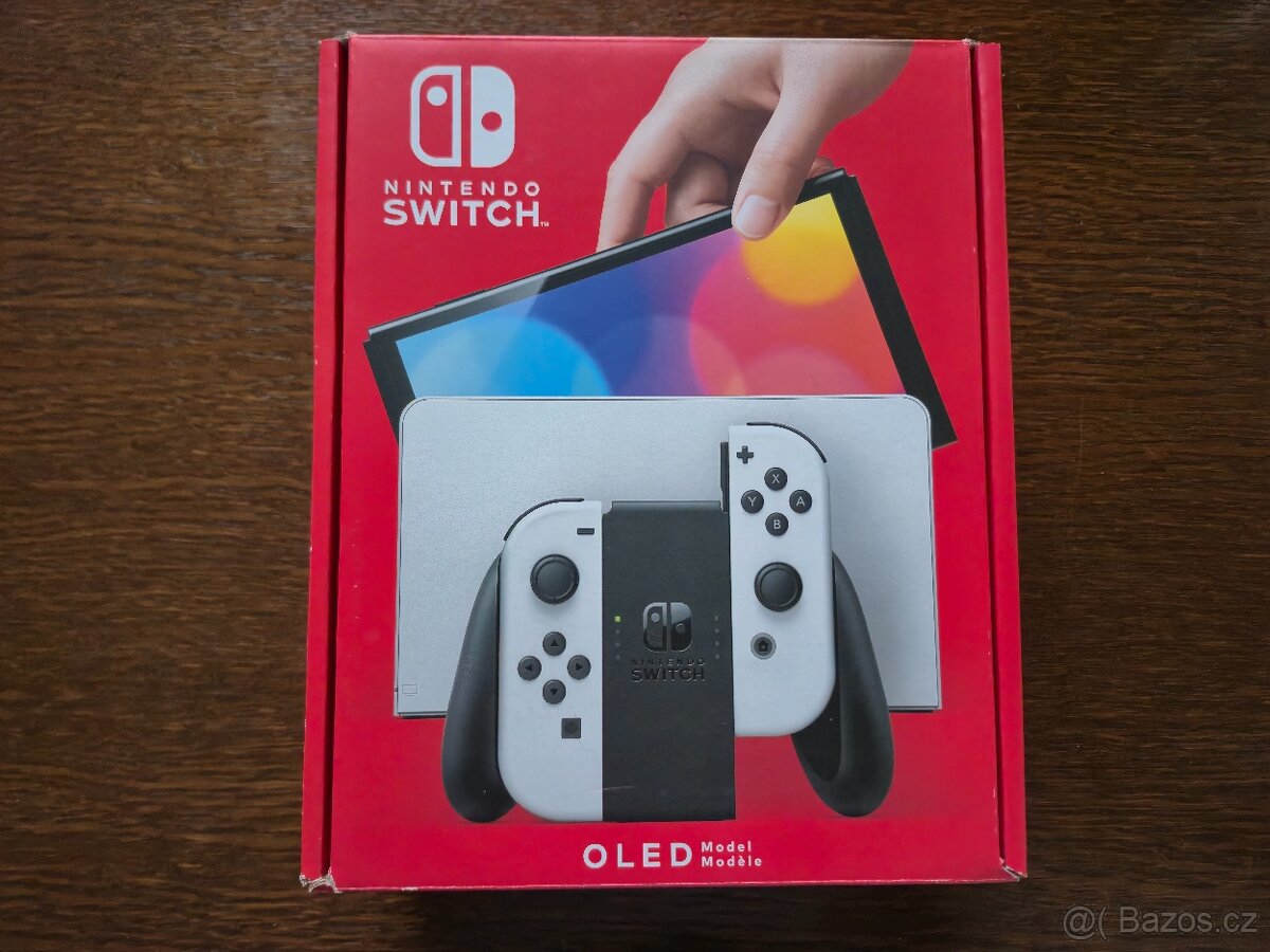 NINTENDO SWITCH OLED (bílá verze) + 4 HRY A CESTOVNÍ OBAL