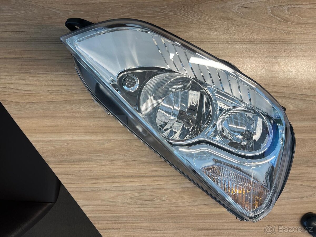 Pravý přední světlomet Ford 1EJ 009 250-02
