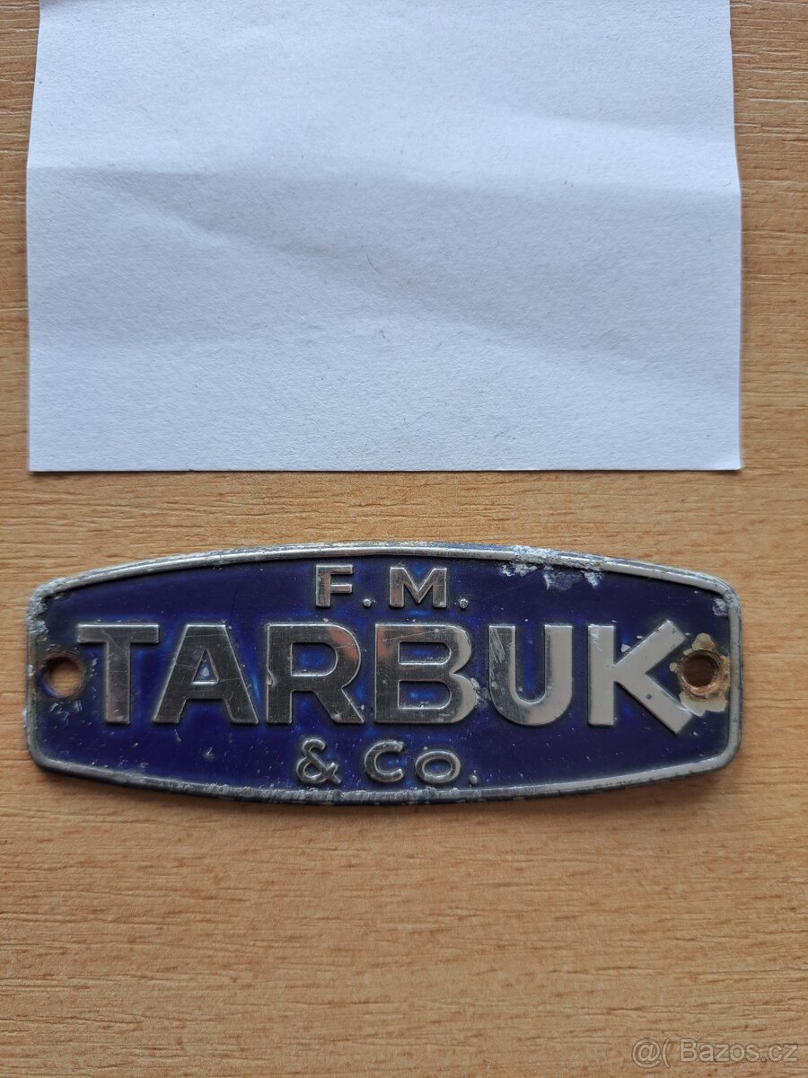 Štítek firmy Tarbuk- Škoda