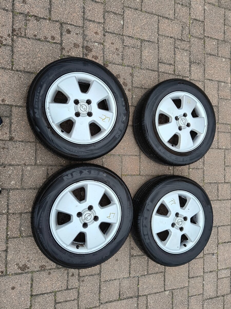 Alu disky+pneu na Opel Astra