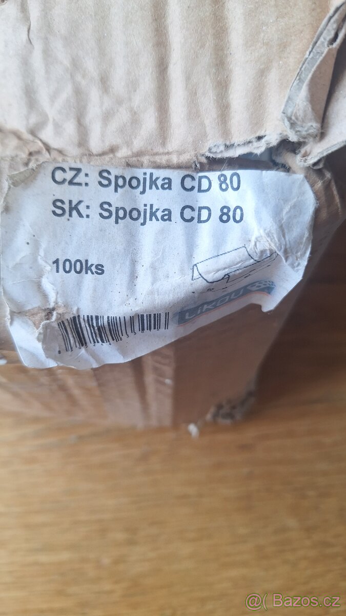Spojka CD pro podélné nastavování CD profilů.