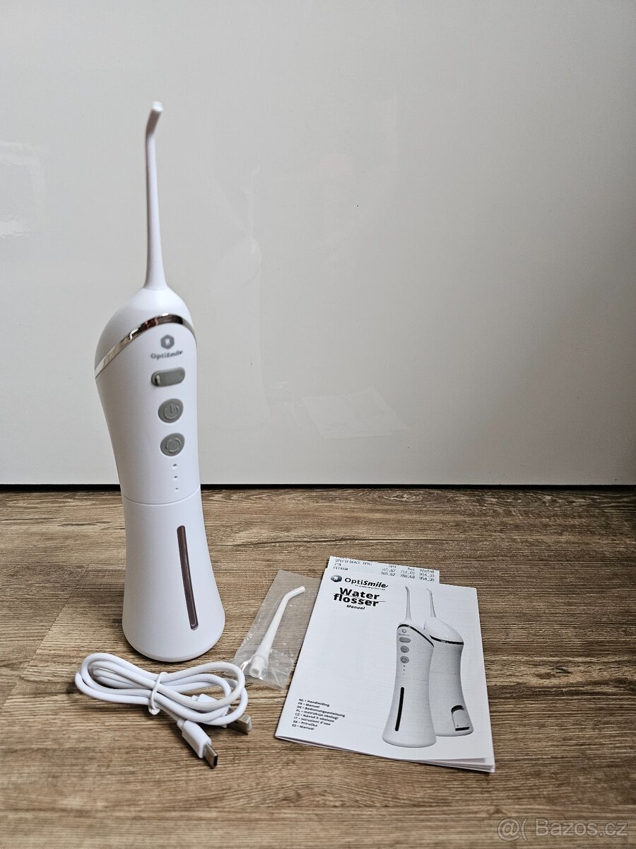 PRODÁM MÁLO POUŽITOU ÚSTNÍ SPRCHU OPTISMILE V ZÁRUCE