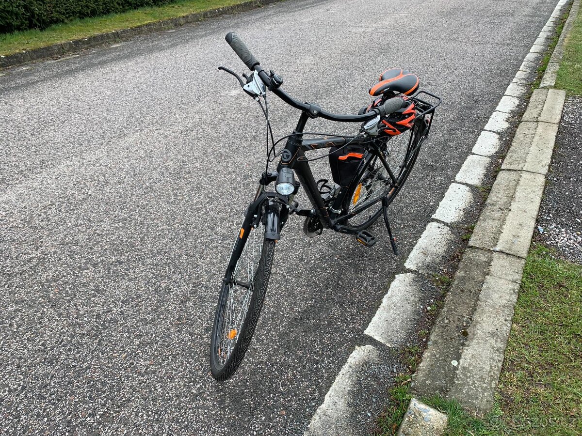 Trekingové kolo Kellys s odpruženou vidlicí SR Suntour a V-b