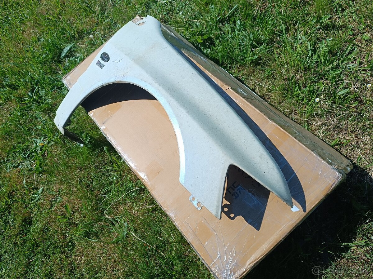 Mitsubishi Lancer Evo Blatníky, palubka,topení