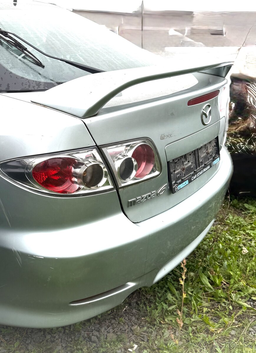 Křídlo,světla Mazda 6 GG