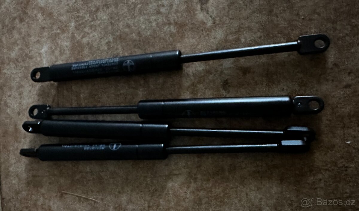 Takeuchi - plynová vzpěra pod levý joystik
