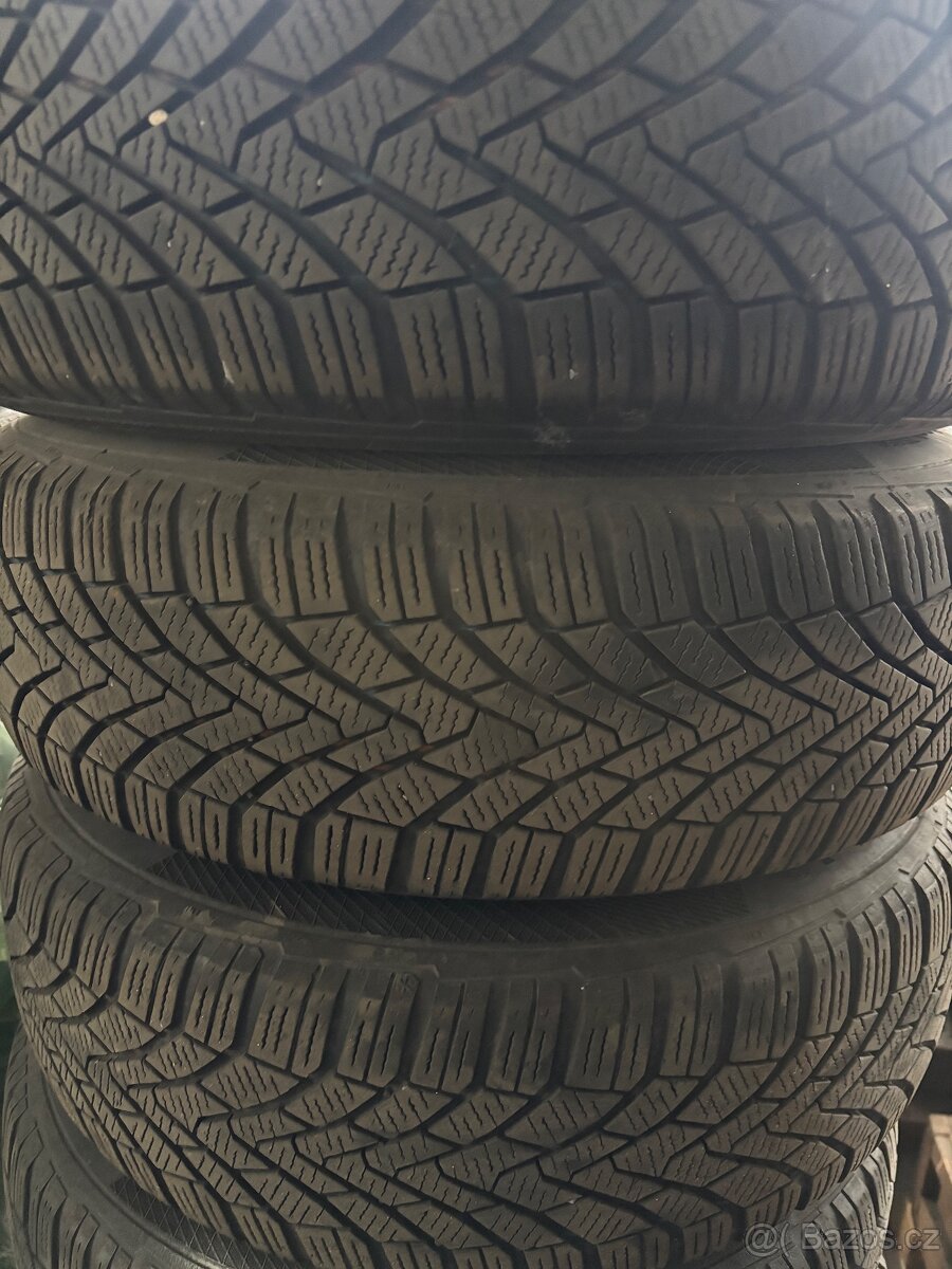 Prodám zimní pneu Continental 185/70 R14 s disky 4x100