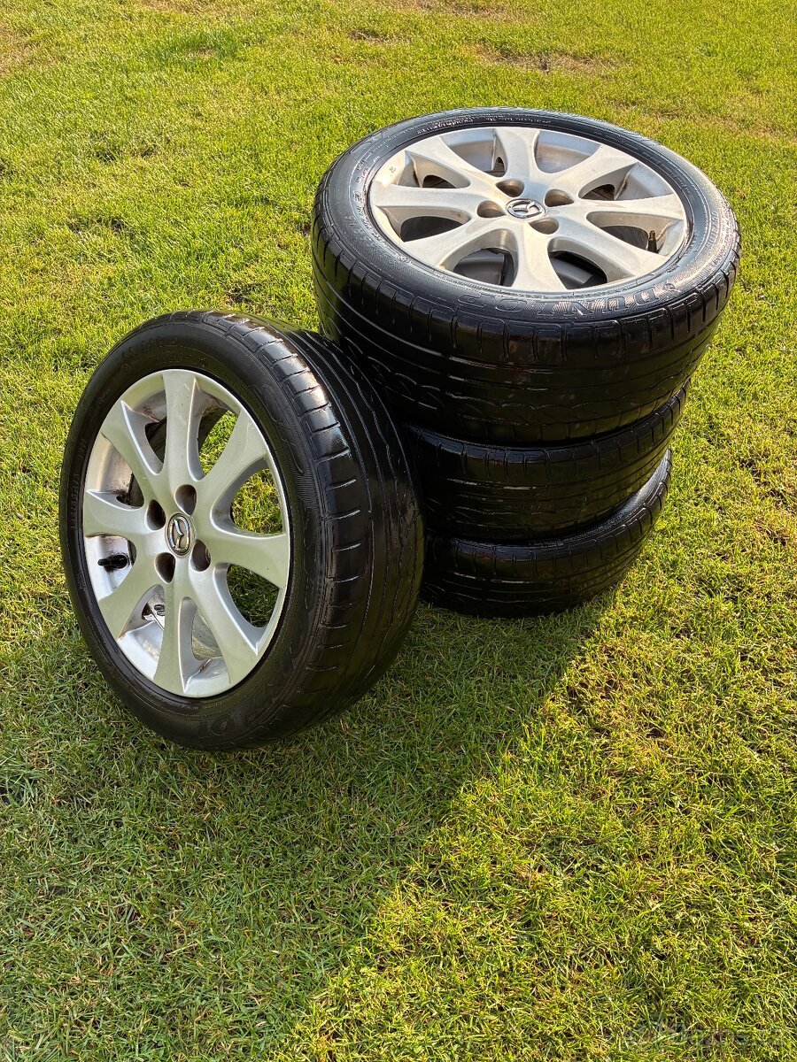 ALU disky s pneu - 2 sady - Mazda