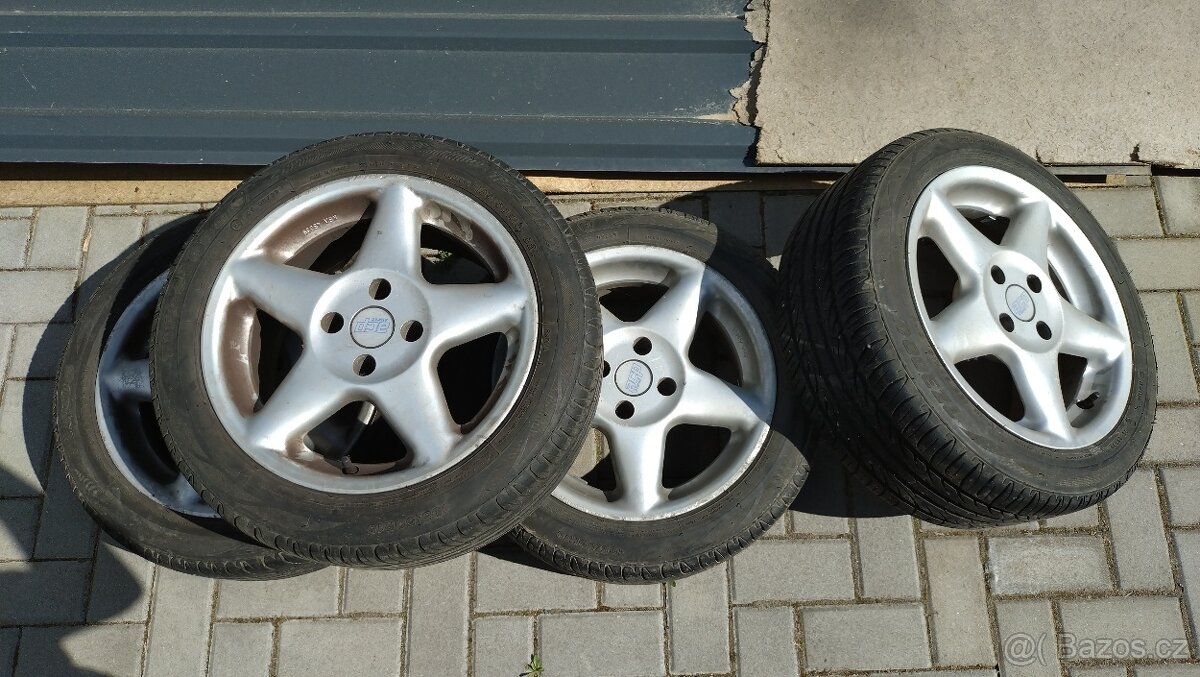 ALU kola 4x100 na letních pneu Firestone 195/50R15