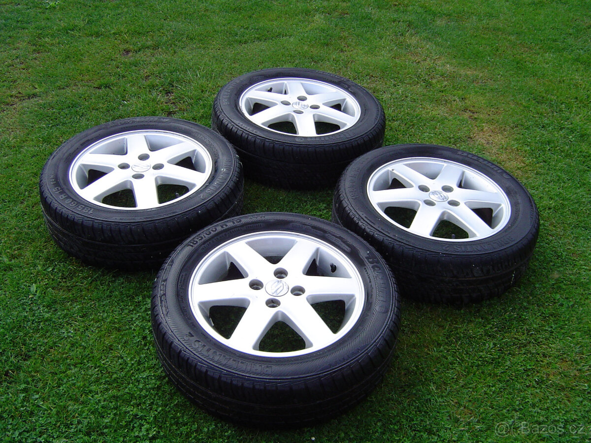 4X LETNÍ HLINÍKOVÁ KOLA SUZUKI SWIFT 185/60 R15