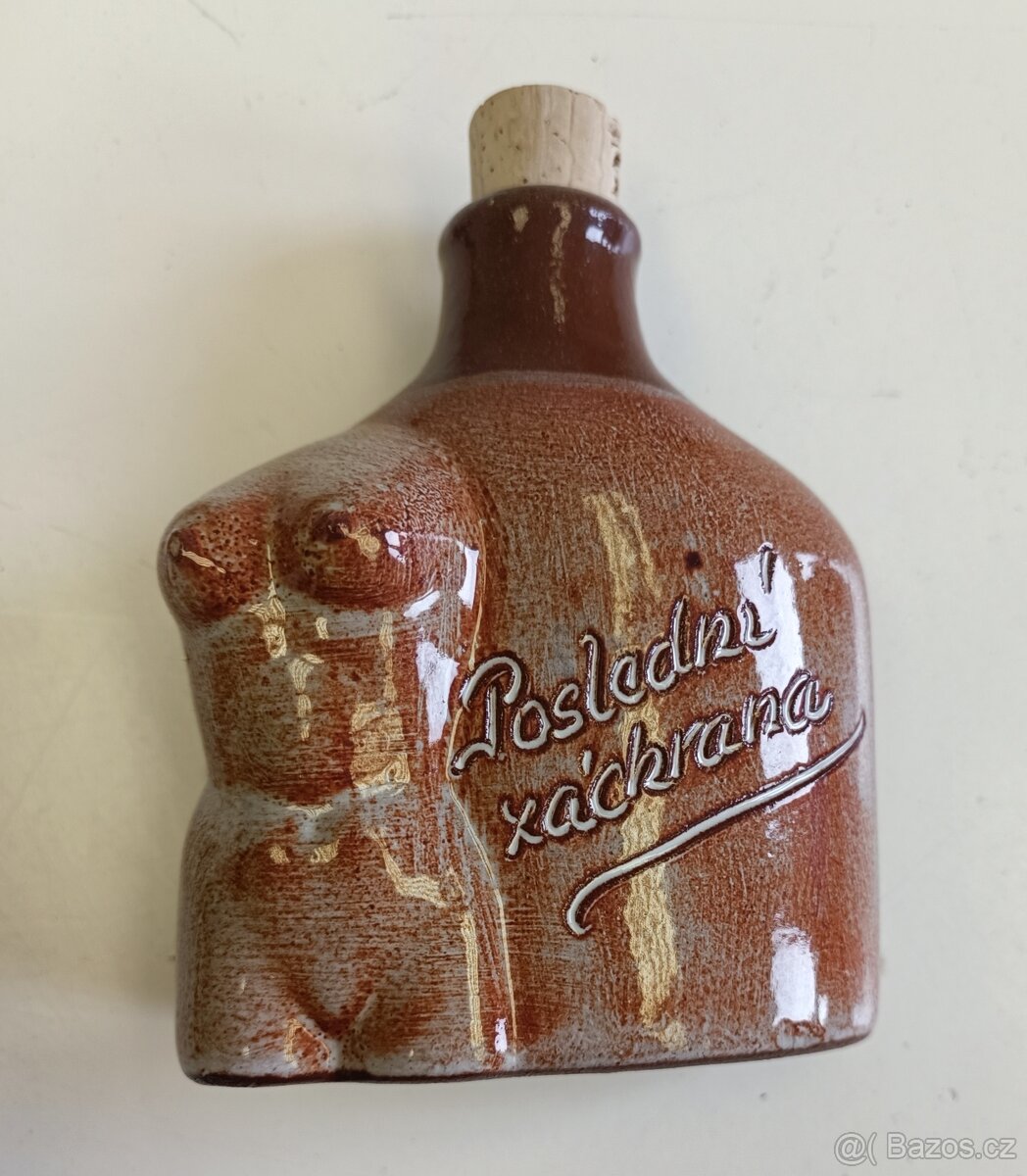 Keramická placatka „Poslední záchrana“ ve tvaru ženského tor