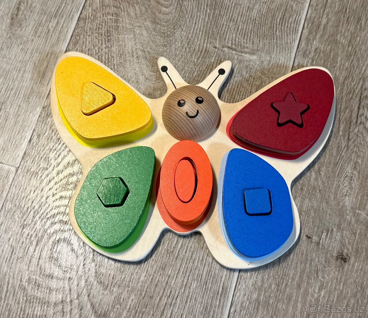 Dřevěná motorická hračka motýl / Playtive