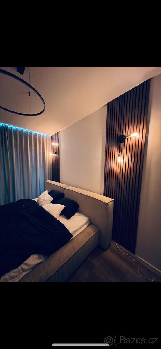 Čalouněná postel z manšestru Lennon Westwing