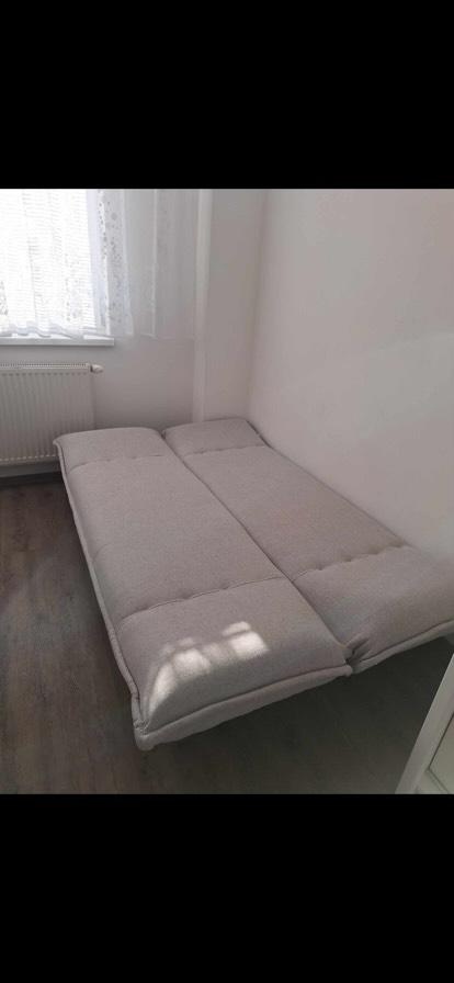 Pohovka rozkládací světle šedá