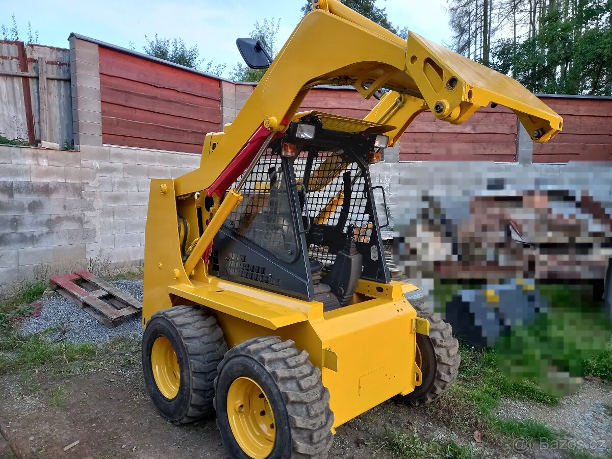 smykový nakladač  KOMATSU SK 09
