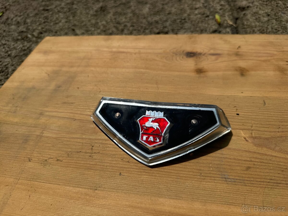 Volha Gaz 24, přední znak originál nový