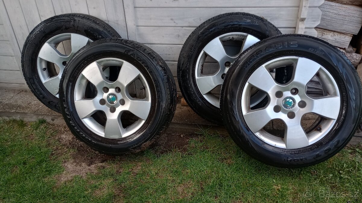 ALU kola Škoda 6,5Jx15 ET50 (HELIOS) s pneu