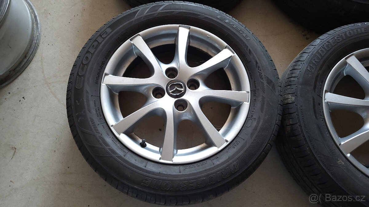 Orig. letní ALU kola 15" 4x100 Mazda 2 (2015 a novější)