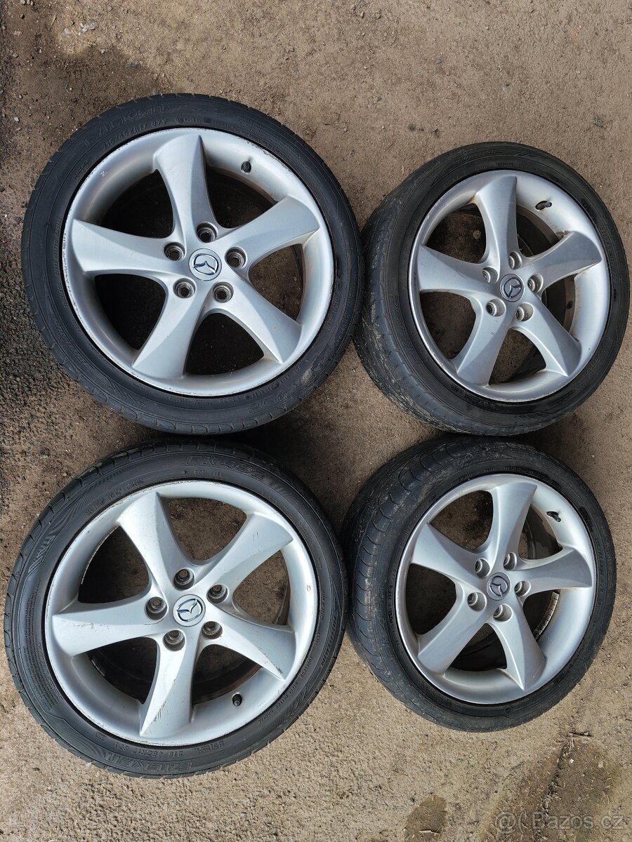 Prodám sadu Alu disků MAZDA 7Jx17H2 ET55 + pneu 215/45/17