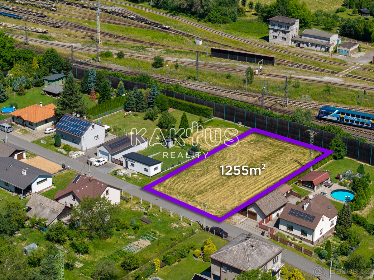 Prodej stavebního pozemku 1255 m2, ul. U Důlňáku, Bartovice