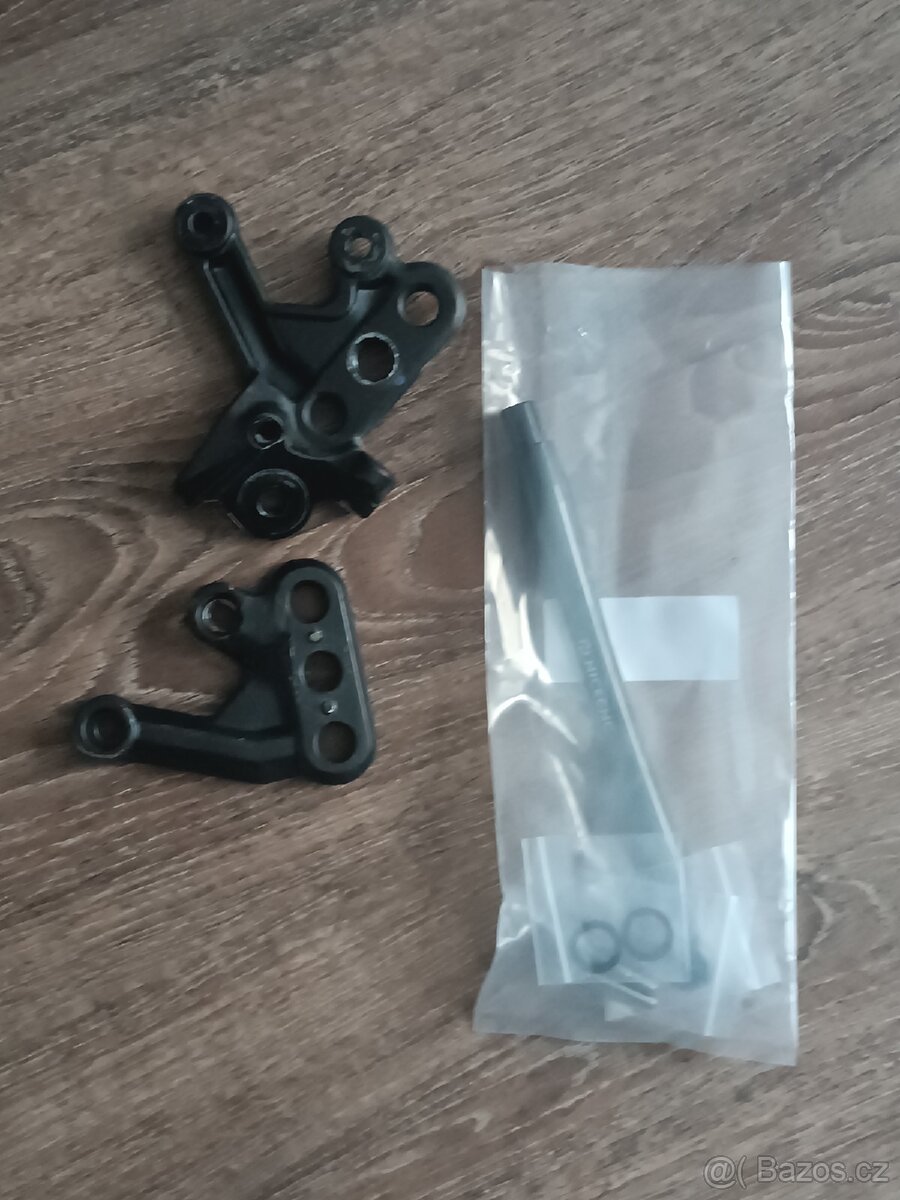 Držiak stupaciek + výstuha pre Surron Light Bee X