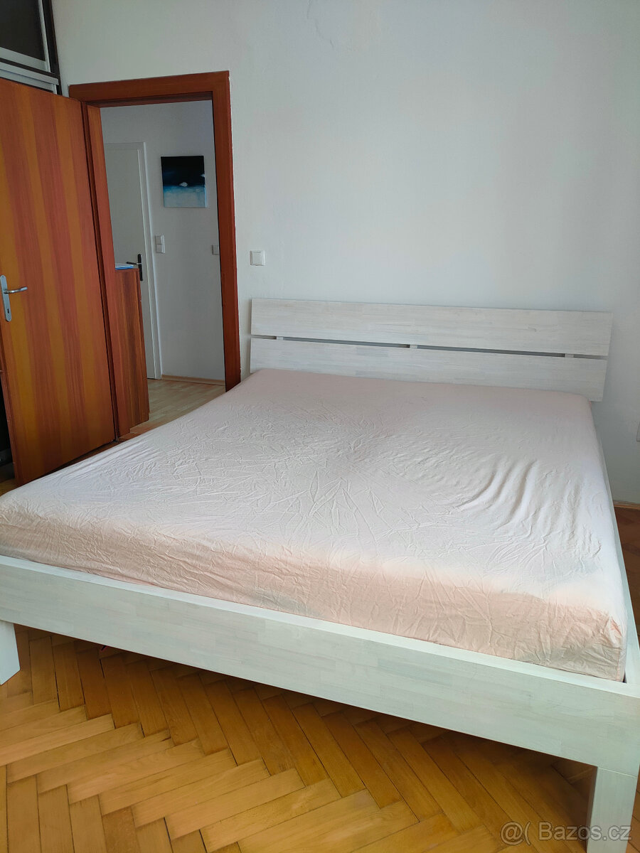 Masivní postel Karnyx dub havea 180x200 vč. roštů
