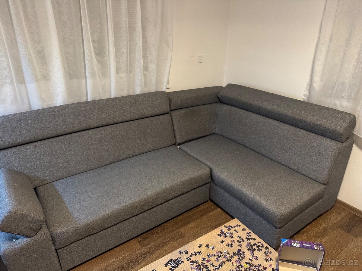 Rohový rozkládací gauč s úložným prostorem, šedý