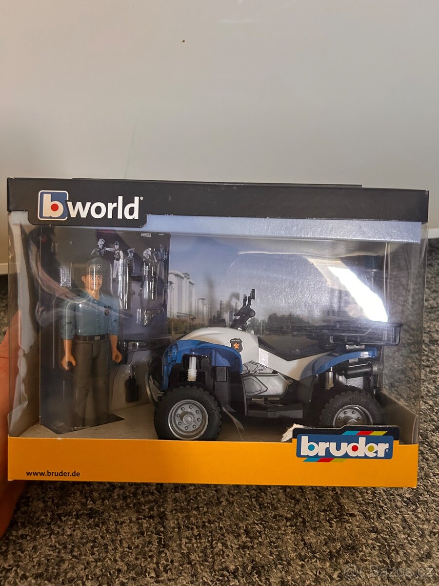 Bruder - modrá čtyřkolka policie s figurkou