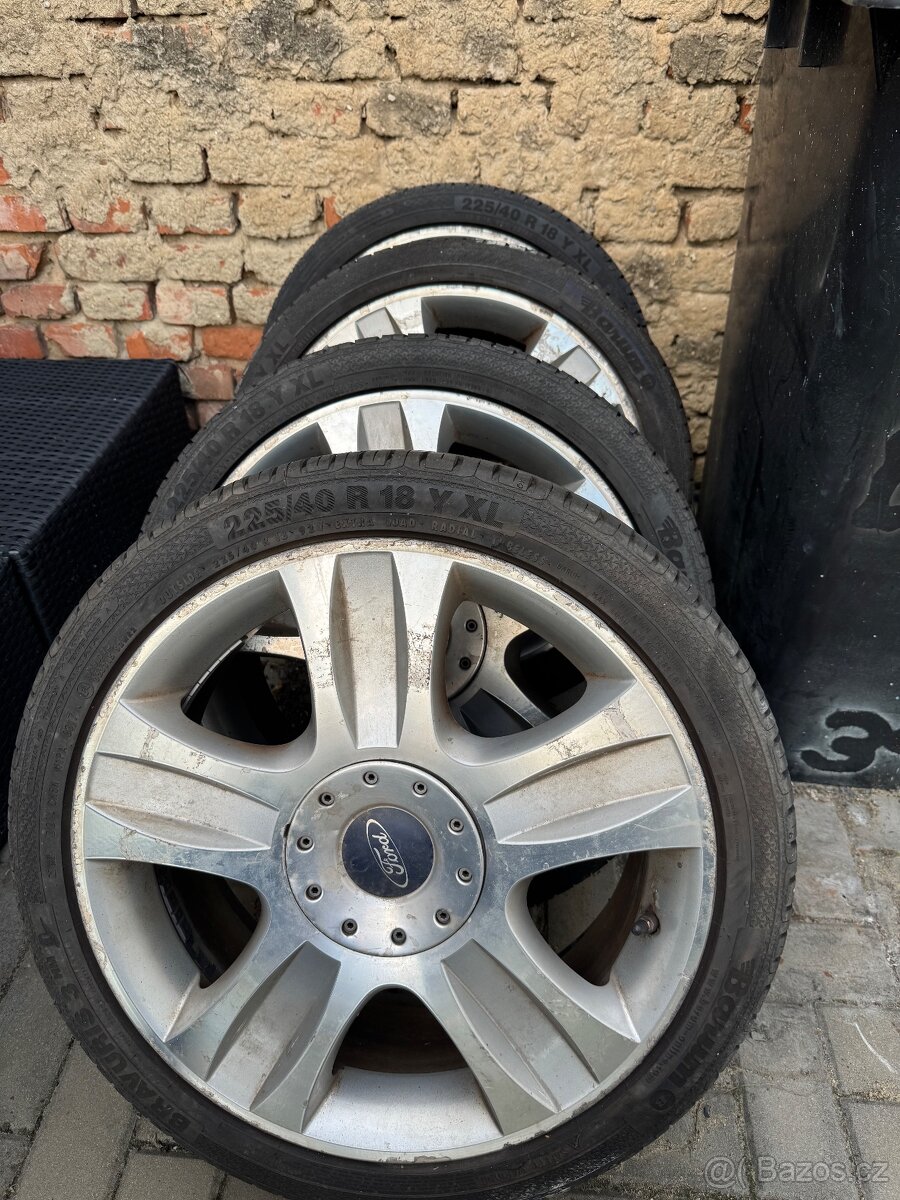 ALU kola Ford s pneumatikami Bravuris 3 R18