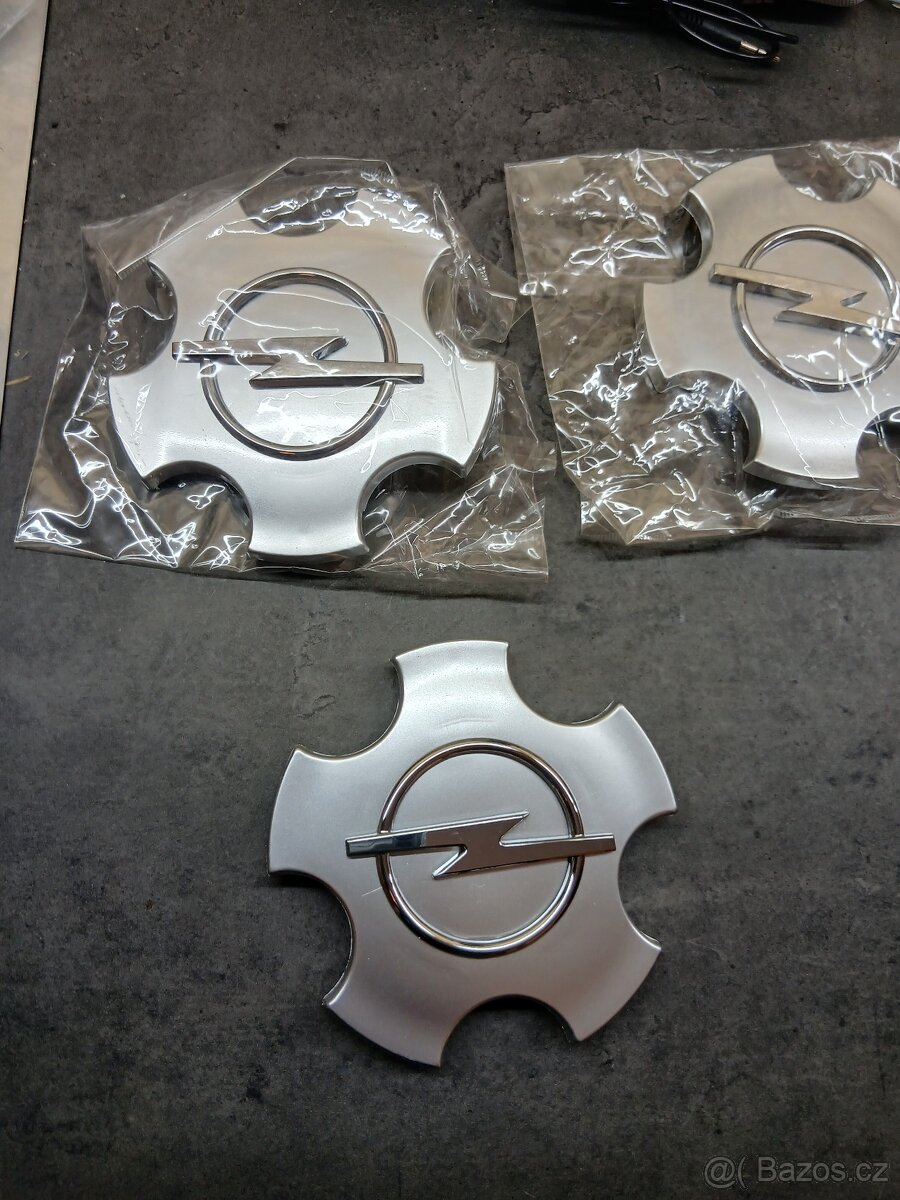 Poklice. Středová krytka kola 90468692, Opel