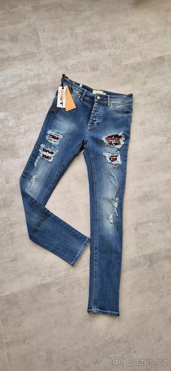 Elegantní trhané džíny Met