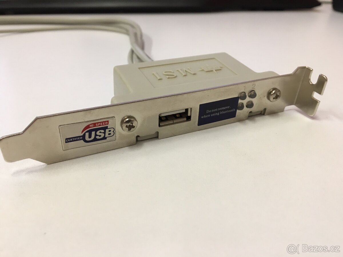 Staré rozširujúce porty (USB a Firewire) z MSI dosky