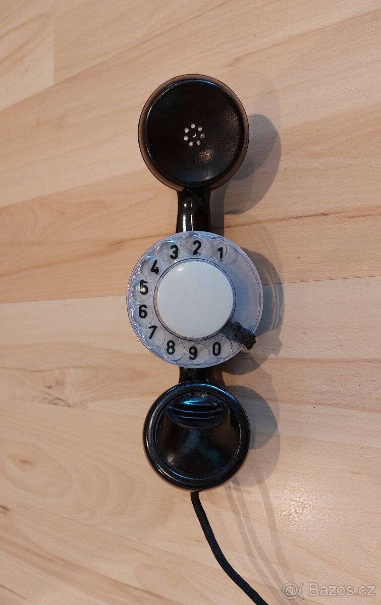 Telefon s integrovaným číselníkem ve sluchátku