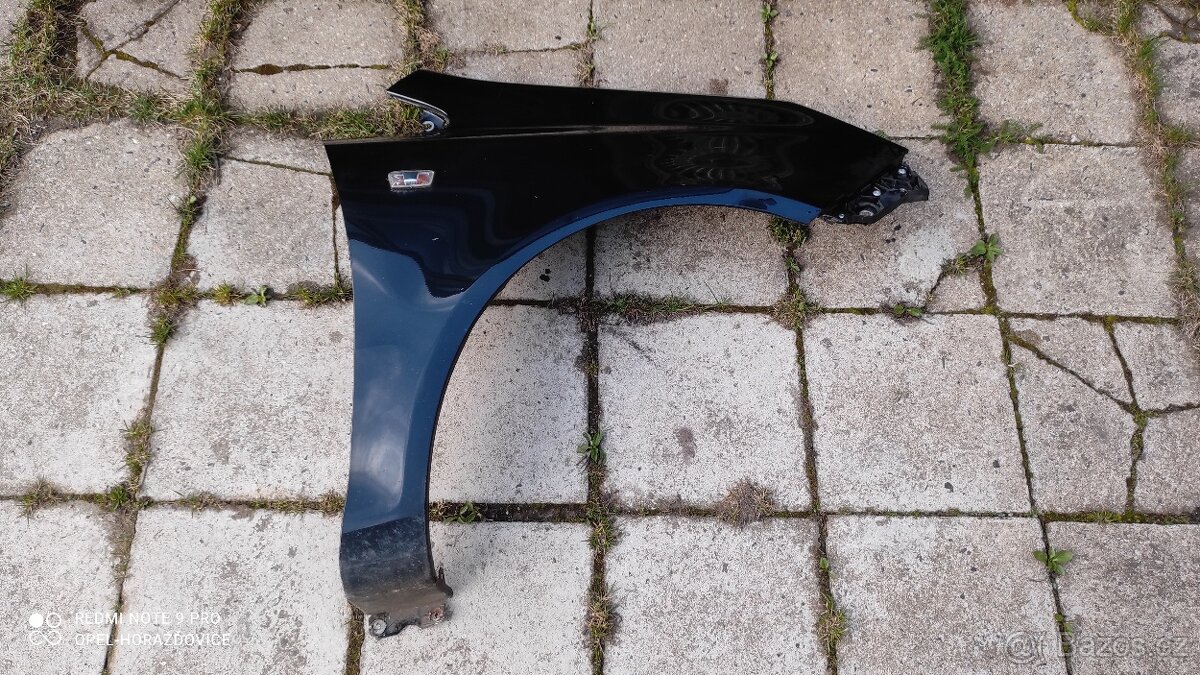 Pravý přední blatník Opel Corsa D - černý