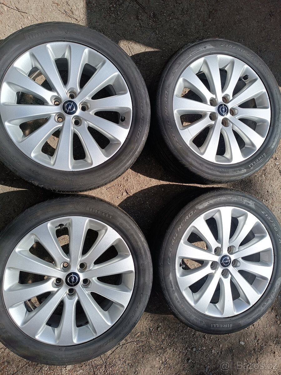 Opel Astra J - alu 7x17 et42 + letní 215/50/17
