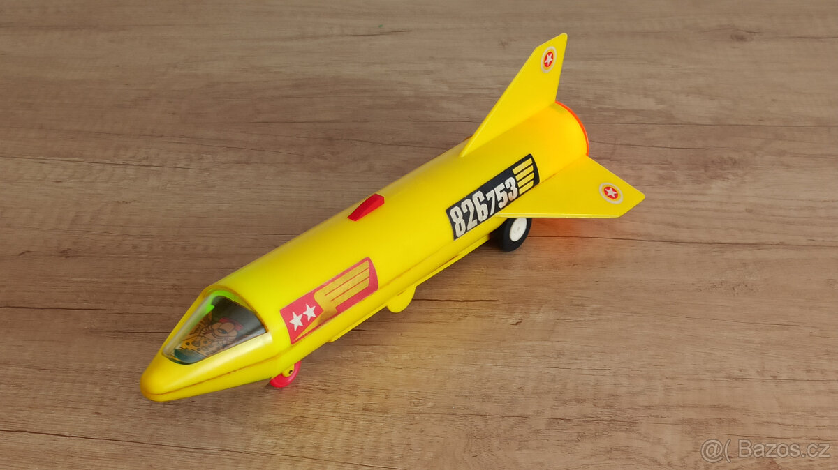 Retro raketa svítící na setrvačník