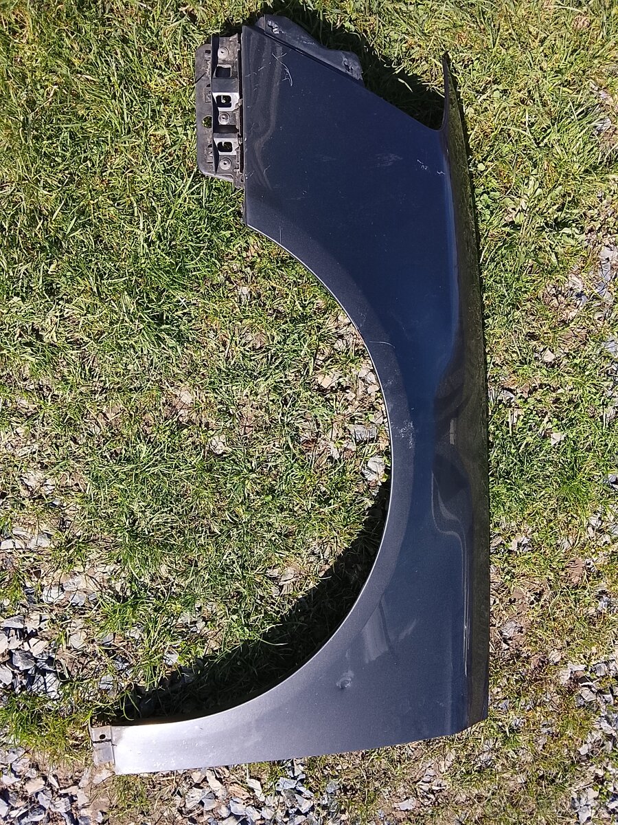 Levý blatník Passat b6