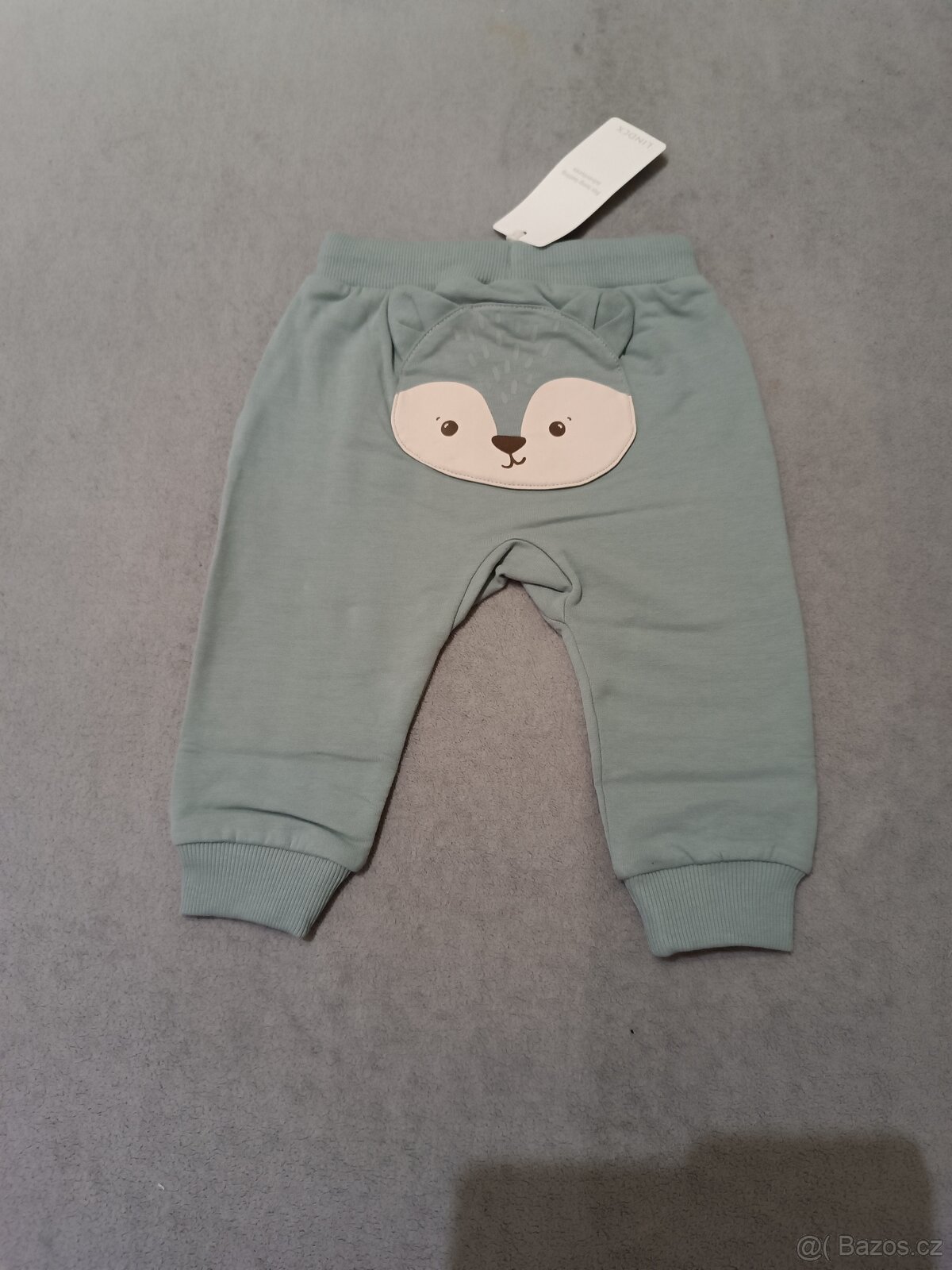 Tepláky Lindex s aplikací vel. 80