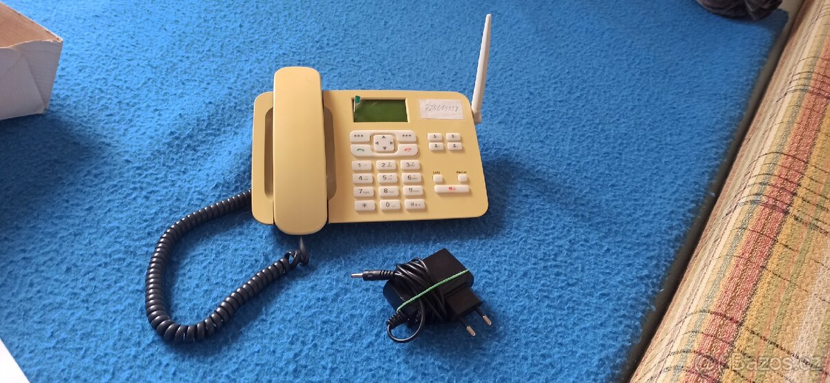 Sarý přenosný telefon