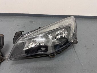 Opel Astra J přední část vozidla kapota blatníky světla - 10
