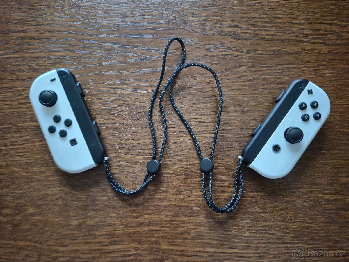 NINTENDO SWITCH OLED (bílá verze) + 4 HRY A CESTOVNÍ OBAL - 11