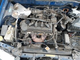 Nissan Almera N16 2002 1,5 1,8i - dily z vozu - 11