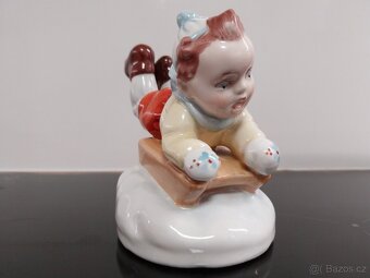 Chlapec na sáňkách - 11