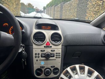 Opel Corsa 1.0i Ecotec rv 2009 - 11