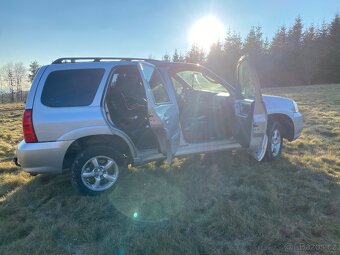 Mazda Tribute 2,3 - 11