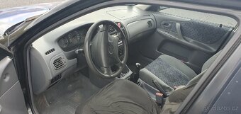 Mazda 323f BJ 1.5 65kw - 11