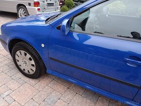 Skoda Octavia combi tour 1.6-75kw,rok 2005,org.km,stk - 11