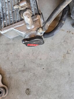 Chladiče a držáky Husqvarna 125 - 11