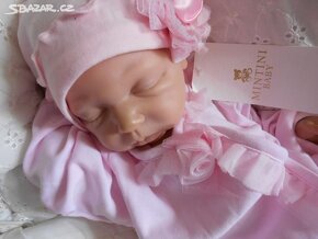 Nový overal Mintini baby vel.9 měs. - 11