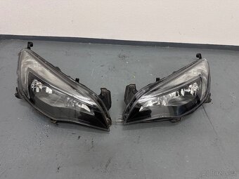 Opel Astra J přední část vozidla kapota blatníky světla - 11